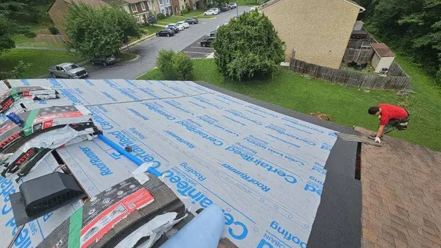 Roofer installing architectural shingles over CertainTeed RoofRunner underlayment on a Laurel, MD home