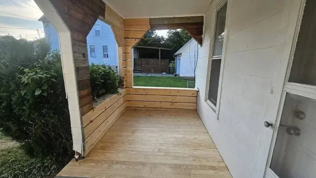 Custom wood porch remodel with new decking and trim in Laurel, MD