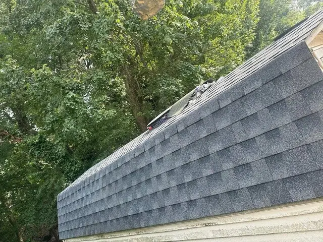 Finished architectural shingles aligned along the rake edge of a Laurel, MD roof